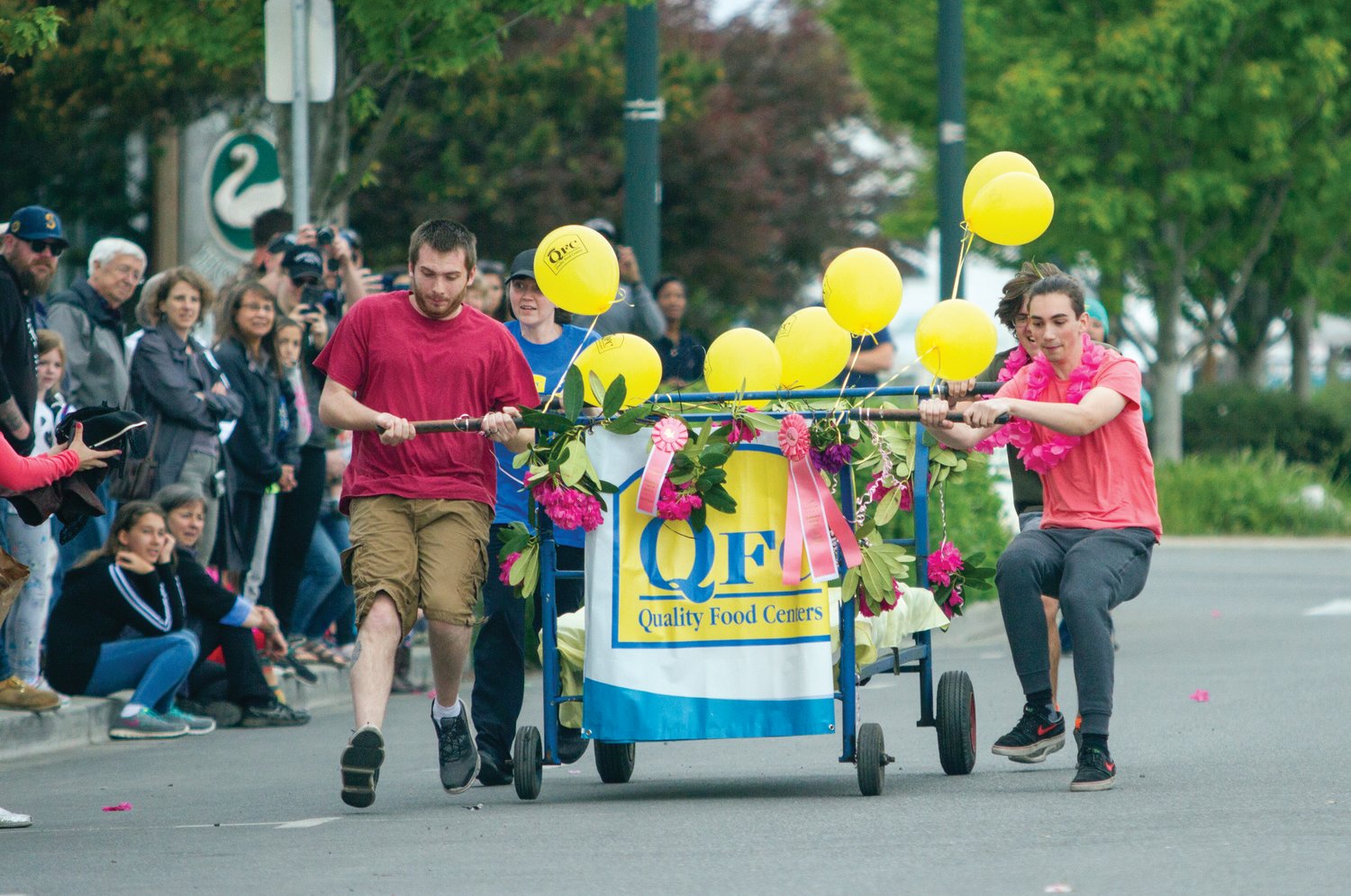 A team from QFC competes in the Bed Races during the 2018 Rhody Festival.